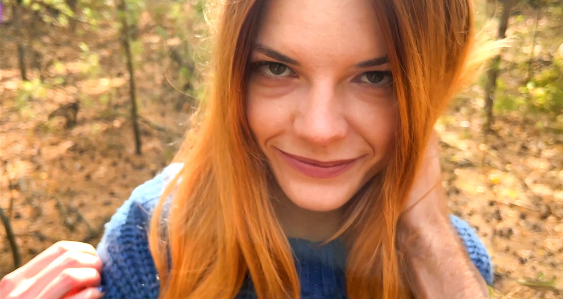Ginger babe swallows cock in the woods