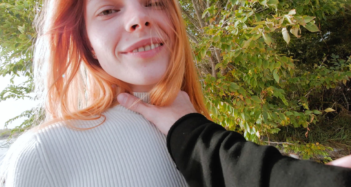 Redhead works cock on the beach