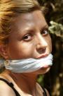 Hottie tied and cleavegagged outside scene photo 8