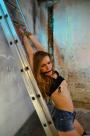Anouk tied to ladder tit-grabbed nipple-clamped scene photo 4
