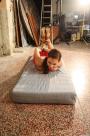 Jenny hogtied on a mattress scene photo 8