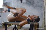 Submissive brunette whore gets machine fucked scene photo 9
