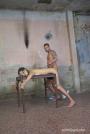 Tied to a table and hardcore fucked from behind scene photo 7
